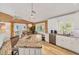 Bright kitchen featuring stone countertops, stainless appliances and breakfast nook with lots of natural light at 123 Hammock Rd, Anna Maria, FL 34216