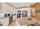 Modern kitchen featuring stainless steel appliances, granite countertops, and ample cabinet space at 123 Hammock Rd, Anna Maria, FL 34216