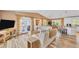 Comfortable living room boasts stylish decor, hardwood floors, and access to an outdoor patio at 123 Hammock Rd, Anna Maria, FL 34216