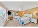 Serene bedroom with coastal decor, a ceiling fan, and great natural light at 123 Hammock Rd, Anna Maria, FL 34216