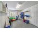 Ground-level storage room with ample space for beach gear, shelves and racks for organization at 123 Hammock Rd, Anna Maria, FL 34216