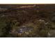 Property surrounded by dense trees, a pond, and a view of city buildings in the distance at 13608 11Th E Ter, Bradenton, FL 34212