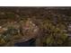 Aerial view showing the property's proximity to the pond, surrounded by trees and neighborhood at 13608 11Th E Ter, Bradenton, FL 34212