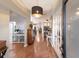 Welcoming foyer with hardwood floors, elegant lighting, and a charming entryway table at 13608 11Th E Ter, Bradenton, FL 34212