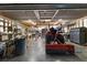 Spacious garage is well-equipped with ample storage and a tractor at 13608 11Th E Ter, Bradenton, FL 34212