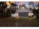 Detached two-car garage with a gable roof, modern lighting, and ample storage space at 13608 11Th E Ter, Bradenton, FL 34212