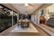 Spacious lanai with a dining table and a view of a wooded lot at 13608 11Th E Ter, Bradenton, FL 34212