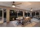 Spacious lanai with a ceiling fans and a large table set for outdoor dining at 13608 11Th E Ter, Bradenton, FL 34212