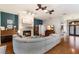 Inviting living room with a stone fireplace, piano, and comfortable seating area at 13608 11Th E Ter, Bradenton, FL 34212