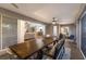 Spacious screened patio with dining table, comfortable seating, and backyard view at 13608 11Th E Ter, Bradenton, FL 34212