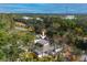 Aerial view of home nestled in trees with a fenced yard at 1397 43Rd St, Sarasota, FL 34234