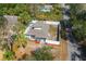Aerial view of home showing the backyard, roof, and mature trees at 1397 43Rd St, Sarasota, FL 34234