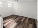 Well-lit room showcases wood floors, neutral walls, and a closet, offering a versatile space at 1397 43Rd St, Sarasota, FL 34234