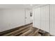 Bedroom features wood floors, neutral walls, closet, and a window offering natural light at 1397 43Rd St, Sarasota, FL 34234