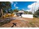 Charming home with white and black trim, complemented by well-placed shrubbery and a manicured front yard at 1397 43Rd St, Sarasota, FL 34234