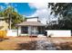 Charming front exterior of home featuring a covered porch and fresh landscaping at 1397 43Rd St, Sarasota, FL 34234