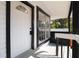 Inviting front porch with black and white trim and a charming front door at 1397 43Rd St, Sarasota, FL 34234