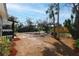 Spacious front yard showcases lush greenery, palm trees and complements a charming home exterior, enhancing curb appeal at 1397 43Rd St, Sarasota, FL 34234