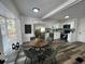 Modern kitchen with white cabinets, stainless steel appliances, and a cozy dining area at 1397 43Rd St, Sarasota, FL 34234