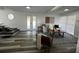 Open living room with gray flooring, a white sofa, and a stylish area rug at 1397 43Rd St, Sarasota, FL 34234
