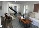 Comfortable living room showcasing a modern staircase and stylish decor at 1397 43Rd St, Sarasota, FL 34234