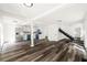Expansive open-concept living space with modern kitchen, stylish staircase, and abundant natural light at 1397 43Rd St, Sarasota, FL 34234
