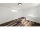 Bright room featuring wood floors, neutral walls, and a small window providing natural light at 1397 43Rd St, Sarasota, FL 34234