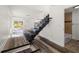 Modern staircase leading to the next level with updated flooring and access to another renovated bathroom at 1397 43Rd St, Sarasota, FL 34234