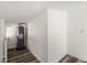 Functional utility space featuring wood floors, neutral walls, and a water heater unit at 1397 43Rd St, Sarasota, FL 34234