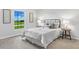 This bedroom is a relaxing space with neutral tones, natural light, and simple yet sophisticated décor at 15110 Keene Ave, Port Charlotte, FL 33953