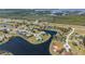 Aerial of waterfront homes with landscaped yards nestled along winding canals and natural Florida landscape in a peaceful area at 16211 Cayman Ln, Punta Gorda, FL 33955