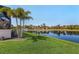 Beautiful backyard with well-maintained lawn and serene water view at 16211 Cayman Ln, Punta Gorda, FL 33955