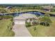 Stunning waterfront home with lush landscaping and a paver driveway at 16211 Cayman Ln, Punta Gorda, FL 33955