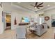Open living room boasts tile floors, neutral walls, and an entertainment center at 16211 Cayman Ln, Punta Gorda, FL 33955