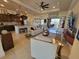 Open-concept living room flows seamlessly to the kitchen and patio, perfect for entertaining at 16211 Cayman Ln, Punta Gorda, FL 33955
