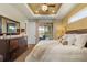 This main bedroom boasts a tray ceiling, private balcony, and a comfortable king-size bed at 16211 Cayman Ln, Punta Gorda, FL 33955