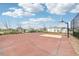 Well-maintained basketball court with a hoop and ample space for recreational games at 16621 Sunburst Lake St, Wimauma, FL 33598