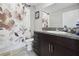 Bathroom featuring a vanity with dark cabinets, granite countertop, and shower with curtain at 16621 Sunburst Lake St, Wimauma, FL 33598