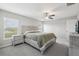 Bright, spacious main bedroom featuring a ceiling fan, and carpeted floors at 16621 Sunburst Lake St, Wimauma, FL 33598