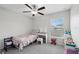 Bright, bedroom featuring a ceiling fan, and carpeted floors at 16621 Sunburst Lake St, Wimauma, FL 33598