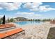 Beautiful community pool with lounge chairs and a spacious deck, perfect for relaxation at 16621 Sunburst Lake St, Wimauma, FL 33598
