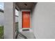 Eye-level view of the home's red front door at 16621 Sunburst Lake St, Wimauma, FL 33598