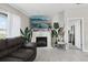 Bright living room features a cozy fireplace, with lots of natural light at 16621 Sunburst Lake St, Wimauma, FL 33598