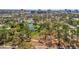 Aerial view of the neighborhood, showcasing the park, trees, and a glimpse of the city at 1664 10Th St, Sarasota, FL 34236
