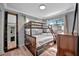 Bedroom with bunkbeds, full length mirror, and dresser at 1664 10Th St, Sarasota, FL 34236