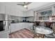 Bright kitchen with white cabinets, stainless steel appliances and a modern subway tile backsplash at 1664 10Th St, Sarasota, FL 34236