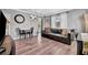 Cozy living room with laminate flooring, a comfortable sofa, and abundant natural light at 1664 10Th St, Sarasota, FL 34236
