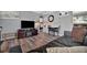 Inviting living room featuring modern flooring, a flat-screen TV, and comfortable seating at 1664 10Th St, Sarasota, FL 34236