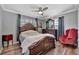 Inviting main bedroom features a large bed, elegant furniture, and natural light from the windows at 1664 10Th St, Sarasota, FL 34236