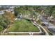 Scenic view of a park with lush green grass, walking path, and trees at 1664 10Th St, Sarasota, FL 34236